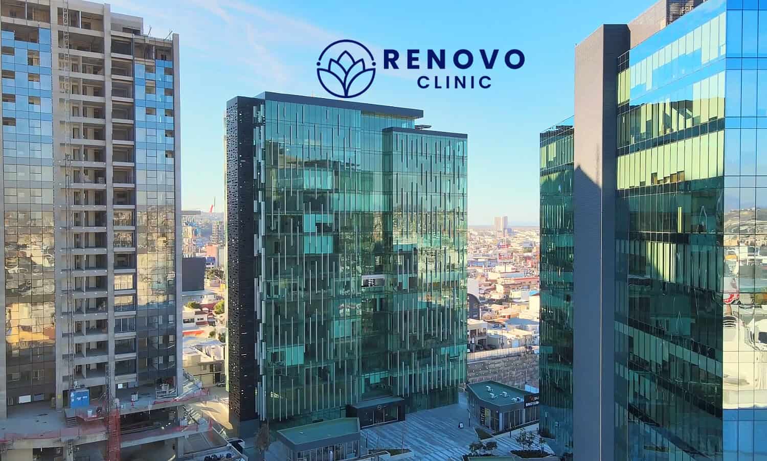 Modern Renovo Clinic building with glass facade in an urban cityscape, representing health and beauty services in a professional setting.