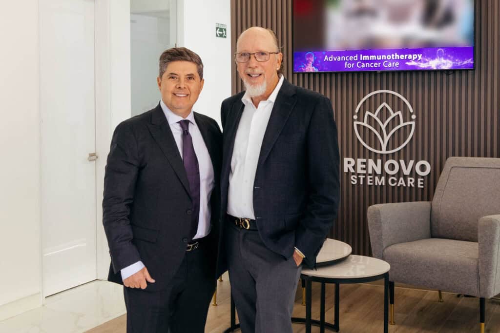 Two professionals at Renovo Health and Beauty collaborating on advanced immunotherapy for cancer care.