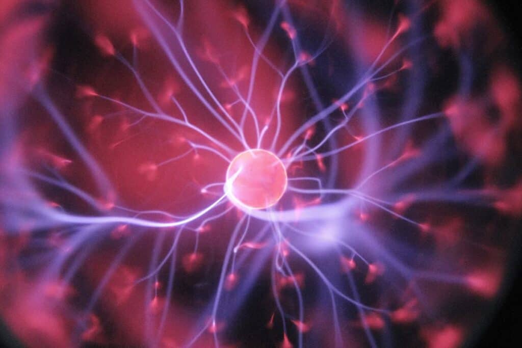Electrotherapy treatment with vibrant plasma and electrical currents, promoting skin rejuvenation and pain relief at Renovo Health and Beauty.