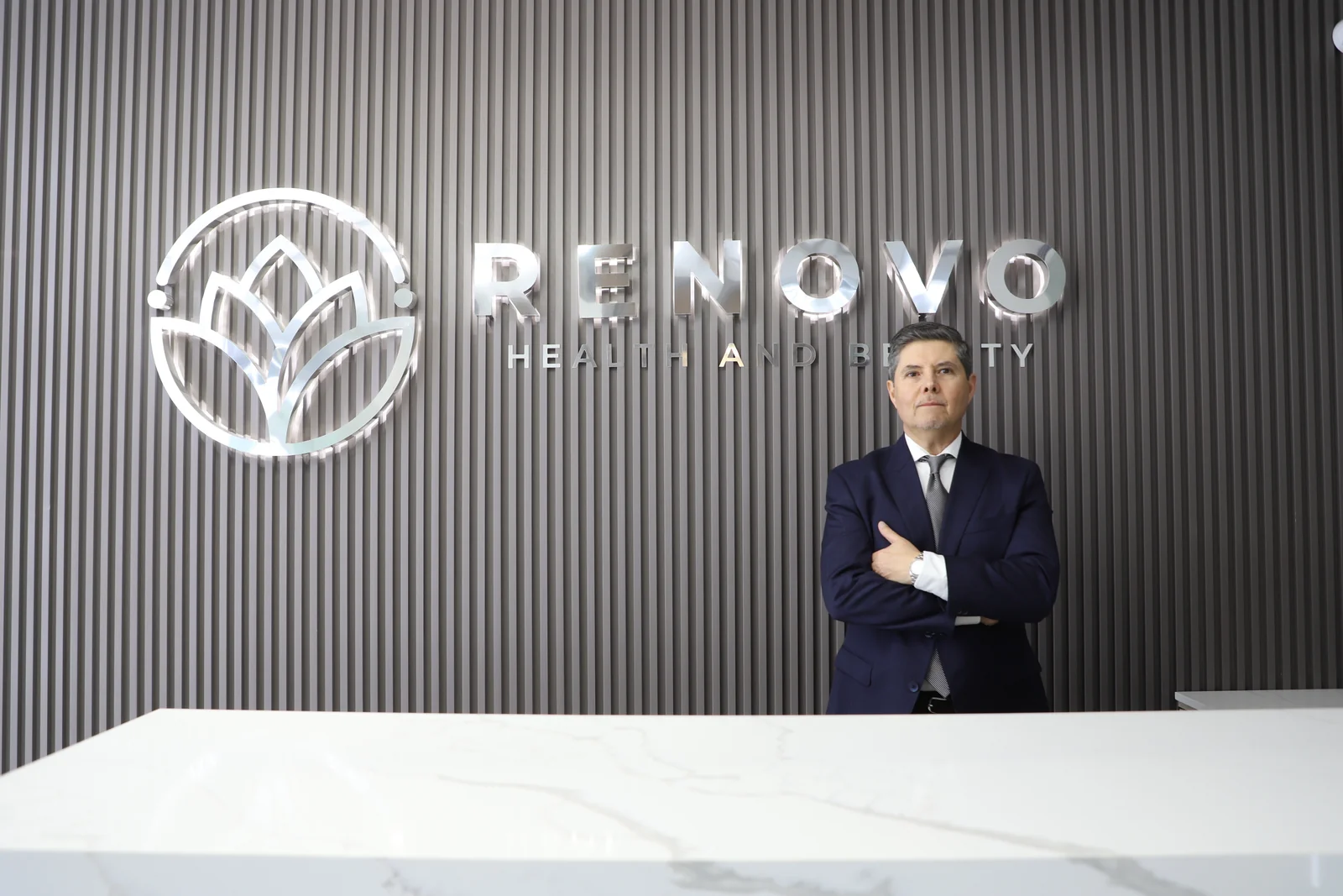 Dr. José A. Jiménez at the reception desk of Renovo Clinic in Tijuana